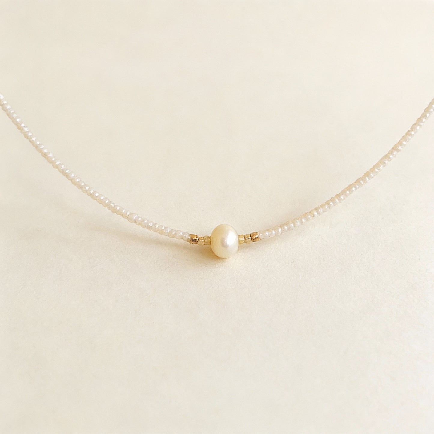 White Beaded Necklace with Center Pearl