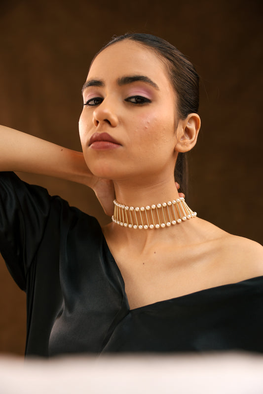 Golden Elegance: Pipe and White Pearl Choker