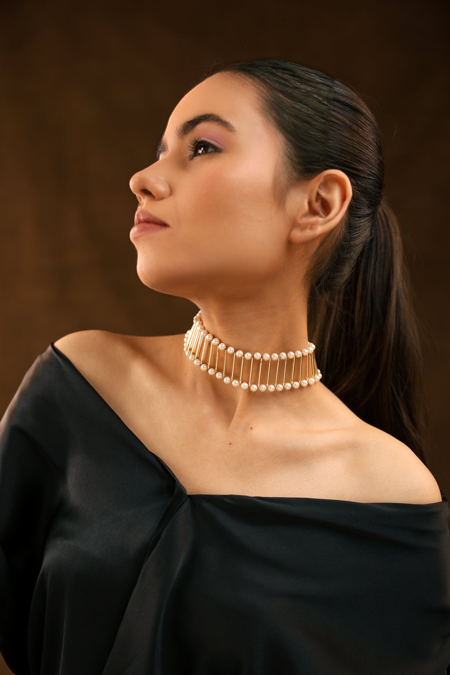 Golden Elegance: Pipe and White Pearl Choker