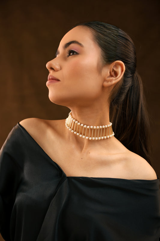 Golden Elegance: Pipe and White Pearl Choker