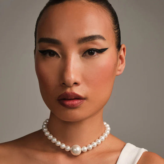 White Pearl Necklace with Bold Center Pearl – Classic with a Twist