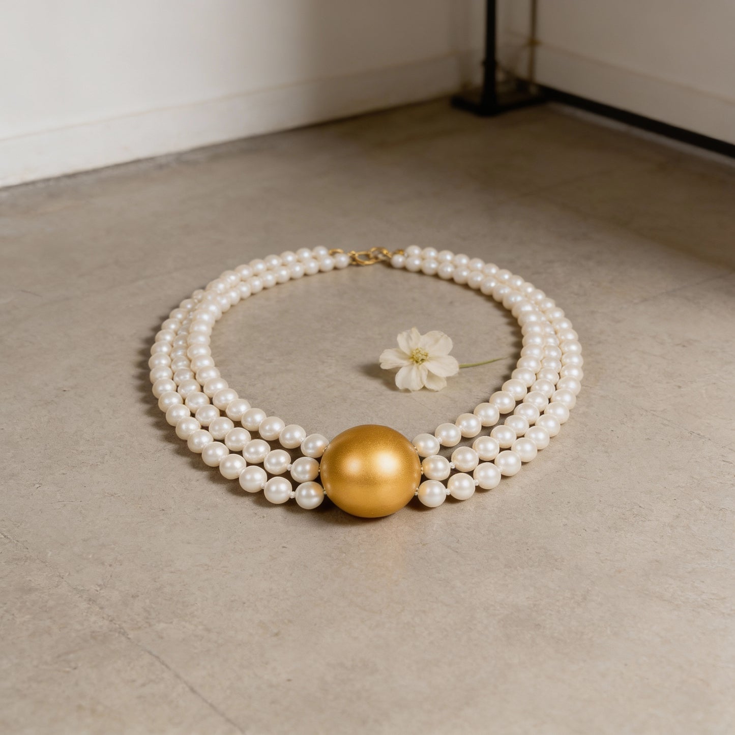 Triple Strand Elegance – White Pearl Choker with Golden Centerpiece