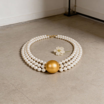 Triple Strand Elegance – White Pearl Choker with Golden Centerpiece